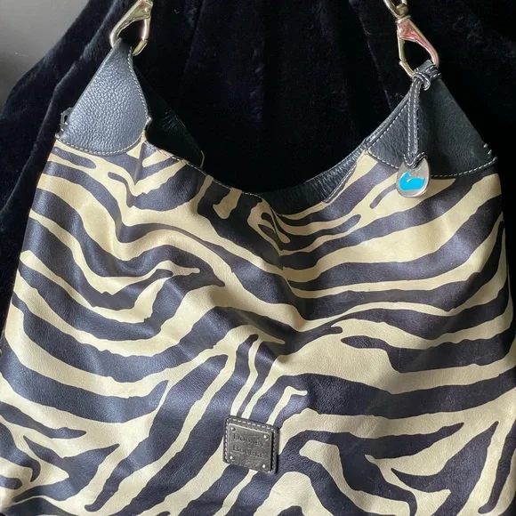 Dooney Bourke large shoulder bag Black white hold metal accents red inside